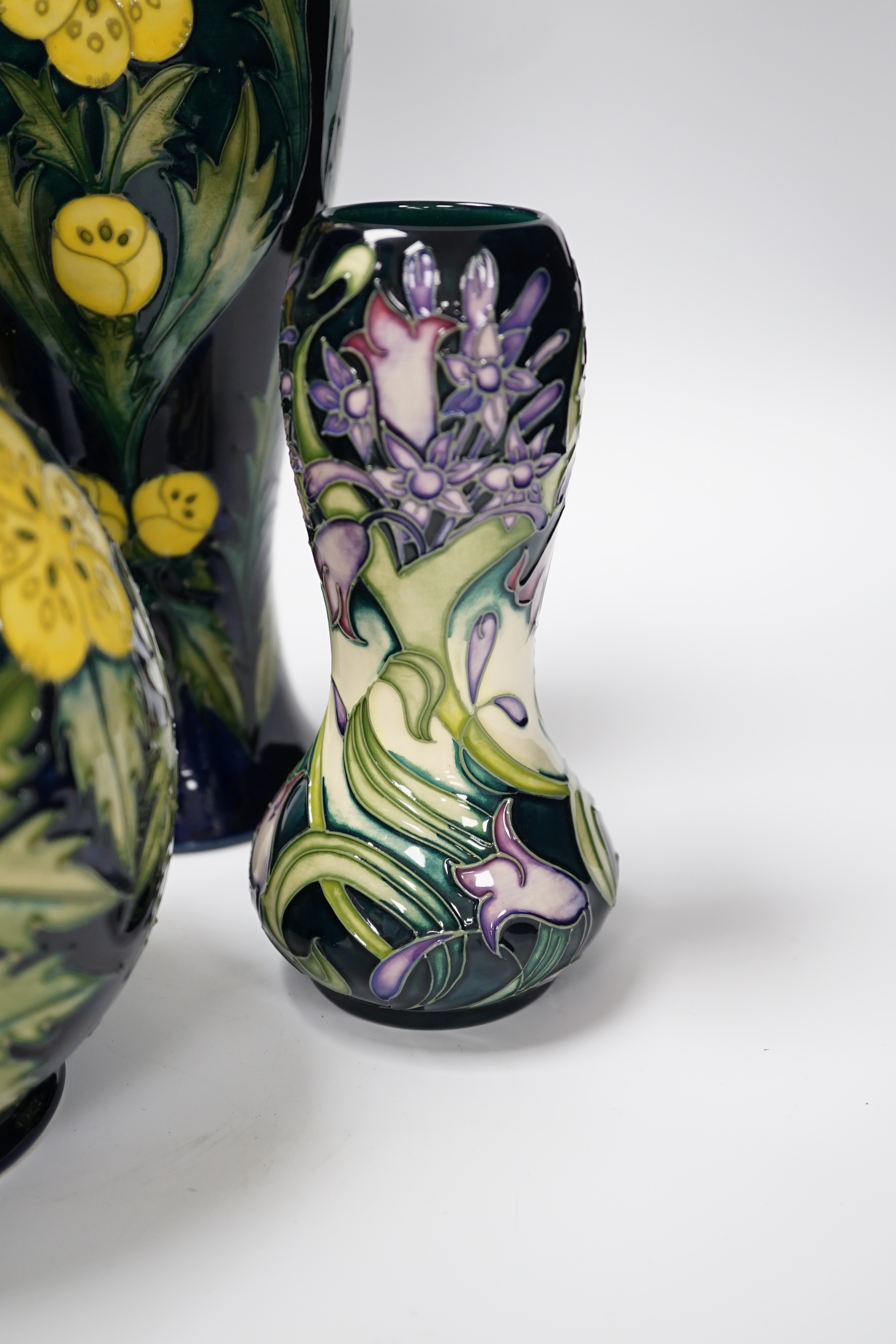 Two Moorcroft 'buttercup' vases and two other Moorcroft vases, tallest 31cm (4)